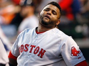 In this Sept. 14, 2015, file photo, Boston Red Sox's Pablo Sandoval stands in the dugout during a baseball game against the Baltimore Orioles i Baltimore. (AP Photo/Patrick Semansky, File)