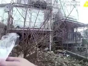 Video footage from a body camera allegedly shows a Baltimore police officer planting a bag of pills at a crime scene. (Screengrab)