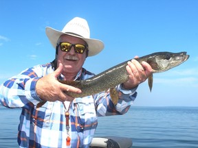 Neil with a Pigeon Lake pike – a little on the skinny side