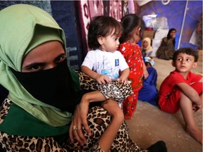 A displaced Iraqi woman, whose family members are accused of being ISIL militants, at the Al-Jadaa camp south of Mosul. Unconfirmed reports suggest 20 female foreign participants in ISIL were caught by Iraqi forces in Mosul last weekend. (Safin Hamed/AFP/Getty Images)