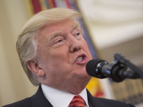 United States President Donald J. Trump speaks as USS Arizona survivors visit the White House on Friday in Washington.