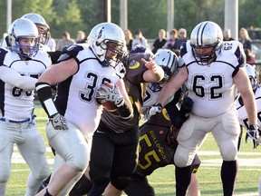 Sudbury Spartans fullback Louis Chartrand (30) runs the ball againats the North Bay Bulldogs at James Jerome Sports Complex on Saturday, June 10, 2017. Sudbury won 9-6. Ben Leeson/The Sudbury Star/Postmedia Network