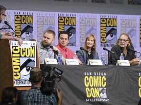 Moderator Chris Hardwick, from left, Robert Kirkman, David Alpert, Gale Anne Hurd, and Greg Nicotero appear on the "Fear The Walking Dead" panel on the second day of Comic-Con International in San Diego on Friday, July 21, 2017. (Al Powers/Invision/AP)