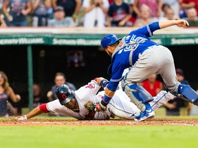 Edwin Encarnacion of the Cleveland Indians is tagged out by catcher Russell Martin of the Toronto Blue Jays to end the fourth inning at Progressive Field on July 21, 2017. (Jason Miller/Getty Images)