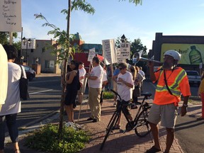 Those protesting the Salvation Army's plan to relocate to Montreal Road stand outside the Vanier Community Service Centre on Friday.