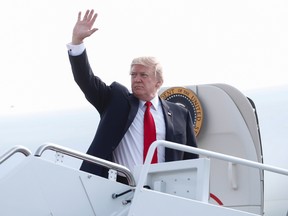 President Donald Trump waves as he boards Air Force One, Saturday, July 22, 2017, in Andrews Air Force Base, Md., en route to Naval Air Station Norfolk, in Norfolk, Va., to attend the commissioning ceremony of the aircraft carrier USS Gerald R. Ford (CVN 78). (AP Photo/Carolyn Kaster)