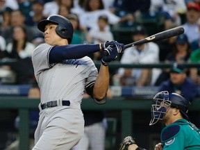 New York Yankees' Aaron Judge watches his three-run home run against the Seattle Mariner during the fifth inning of a baseball game Friday, July 21, 2017, in Seattle. (AP Photo/Ted S. Warren)