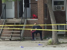 Winnipeg Police Service officer on Saturday, July 22, 2017, outside of the scene of a homicide in the 700 block of Selkirk Avenue which occurred around 10 p.m., on Friday, July 21, 2017. Upon arrival, officers found an adult male suffering from a gunshot wound who was transported to hospital in critical condition but later died.