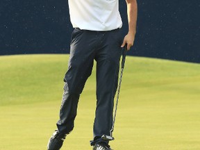 Austin Connelly of Canada celebrates a birdie on the 18th green during the third round of the 146th Open Championship at Royal Birkdale on July 22, 2017 in Southport, England. (Andrew Redington/Getty Images)