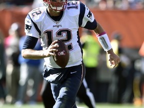 In this Oct. 9, 2016, file photo, New England Patriots quarterback Tom Brady (12) runs with the ball during an NFL football game against the Cleveland Browns, in Cleveland. The Falcons (13-5) take on the New England Patriots (16-2) in Super Bowl LI in Houston on Feb. 5, 2017. (AP Photo/David Richard)