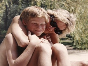 In this photo made available by Kensington Palace from the personal photo album of the late Diana, Princess of Wales, shows the princess and Prince Harry on holiday, and features in the new ITV documentary 'Diana, Our Mother: Her Life and Legacy.' (The Duke of Cambridge and Prince Harry/Kensington Palace via AP)