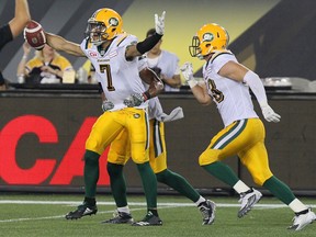 Edmonton Eskimos' Josh Woodman (7) celebrates after he intercepted a pass during fourth quarter CFL football action against the Hamilton Tiger-Cats in Hamilton, Ont., on Thursday, July 20, 2017.