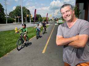 Beacon Hill-Cyrville Coun. Tim Tierney poses for a photo along the bike road on Ogilvie Road in Ottawa Ontario Friday July 21, 2017.