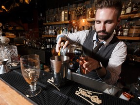 Made with Love in Edmonton competition contestant Leland Morrison mixes an Armchair Cynic drink at Black Pearl Seafood Bar at 10132 104 Street in Edmonton on Thursday, July 20, 2017. Ian Kucerak / Postmedia