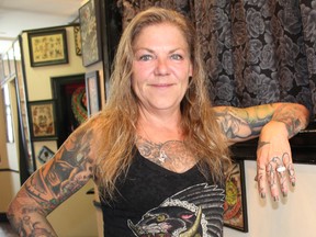Jacqui Gallant remembers a time when tattoos were subversive. Here she is at Addictive Tattoo, the tattoo studio she opened in downtown London in 1996.  (CHARLIE PINKERTON, The London Free Press)
