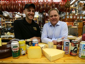 Afrim Pristine with the Cheese Boutique and Toronto's Festival of Beer president Les Murray are preparing for the 21st edition of Toronto's Festival of Beer, this weekend (July 28-30) at Exhibition Place. (DAVE ABEL/TORONTO SUN)