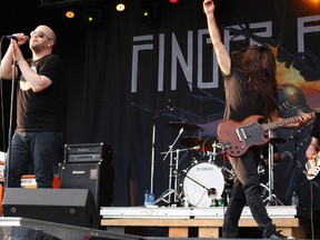 Finger Eleven's lead vocalist Scott Anderson (left) and guitarist Rick Jackett (right) perform during the East Coast Garden Party at South Bear Creek Park on Friday July 21, 2017 in Grande Prairie, Alta. Finger Eleven is Canadian rock band from Ontario. Many came out to see the different bands perform. 
Nicole Auger/Grande Prairie Daily Herald-Tribune/Postmedia Network