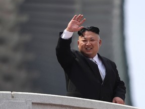 North Korean leader Kim Jong-un waves during a military parade on April 15, 2017. (AP/PHOTO)