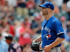 Toronto Blue Jays starting pitcher J.A. Happ waits for Cleveland Indians' Michael Brantley to run the bases after Brantley hit a two-run home run in the sixth inning July 23, 2017, in Cleveland.(TONY DEJAK/AP)