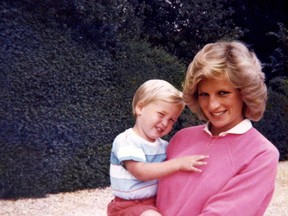 In this photo made available by Kensington Palace from the personal photo album of the late Diana, Princess of Wales, shows the princess holding Prince William whilst pregnant with Prince Harry, and features in the new ITV documentary 'Diana, Our Mother: Her Life and Legacy.' Prince William and Prince Harry will pay tribute to their mother, Princess Diana, as the 20th anniversary of her death in a car crash approaches in a TV documentary “Diana, Our Mother: Her Life and Legacy” which will air Monday July 24, 2017 on British TV. (The Duke of Cambridge and Prince Harry/Kensington Palace via AP)