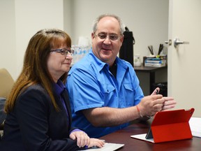 Richard Bangma (right), library director for the Whitecourt and District Public Library, gives an overview and update for the library to Woodlands County Council on July 18. Ex-library board member Barb Maddigan sits to his left (Peter Shokeir | Whitecourt Star).