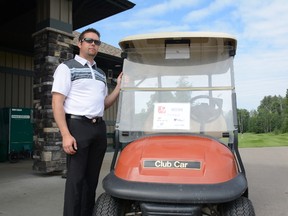 Trevor Commet, general manager and head golf professional, stands next to his cart during the 2017 Men's Open at the Whitecourt Golf and Country Club on July 22 (Peter Shokeir | Whitecourt Court).