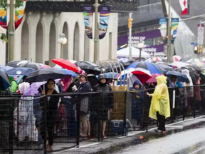 Thousands of people line up for security checks along Wellington Street near Bank Street during Canada Day celebrations in downtown Ottawa Saturday, July 1, 2017. DARREN BROWN / POSTMEDIA