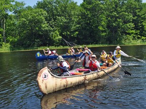 Canadian Canoe Pilgrimage participants travel down the Wye River near Midland as they start their month-long journey to Montreal Friday afternoon. (Andrew Philips/Special to Postmedia Network)