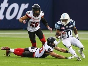 Marlese Jackson of the Toronto Argonauts gets away from Dan West of the Ottawa Redblacks at BMO field in Toronto during CFL action on July 24, 2017. (Dave Abel/Toronto Sun/Postmedia Network)