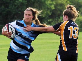 Belleville's Sara Svoboda of Ontario fends off a Nova Scotia defender during the national senior women's rugby championships held recently in Truro, NS. (Submitted photo)