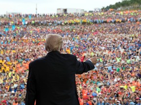 President Donald Trump gestures to the crowd after speaking at the 2017 National Scout Jamboree in Glen Jean, W.Va., Monday, July 24, 2017. (AP Photo/Carolyn Kaster)