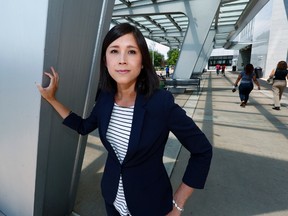 Noi Liang, an intersex woman who works part-time as a patient advocate at Children's Hospital Colorado, stands for a photo at the medical center in the Denver suburb of Aurora, Colo., on Friday, July 7, 2017. Liang, who works for a technology firm, says the parents considering surgery for very young intersex children tend to be thorough and thoughtful in their deliberations, hoping that the decisions they make will be the ones that their children _ looking back years from now as adults _ would have wanted them to make. (AP Photo/David Zalubowski)