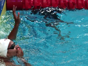 Canada's Kylie Jacqueline Masse celebrates a new world record after the women's 100m backstroke final during the swimming competition at the 2017 FINA World Championships in Budapest, on July 25, 2017. (Ferenc Isza/AFP/Getty Images)