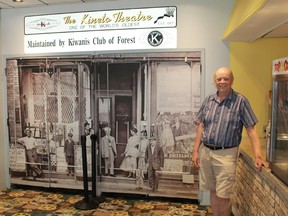 Kiwanis Club of Forest member Glen Starkey stands in front of the theatre's doors, which are decorated with a print of one of the earliest pictures of the theatre, taken in 1917.
CARL HNATYSHYN/SARNIA THIS WEEK