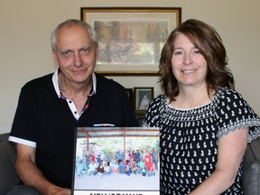 Dr. Doug Thompson and Janice Rauser hold up a book from their trip to Nicaragua earlier this year on Tuesday, July 25, 2017 in Stratford, Ont. The Canadian Outreach Medical and Mission Team is planning a return journey Jan. 18 to Feb. 3, 2018. (Terry Bridge/Stratford Beacon Herald/Postmedia Network)