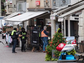 The police investigate in the old town of Schaffhausen in Switzerland, where they search for an unknown man who attacked people, Monday, July 24, 2017. (Ennio Leanza/Keystone via AP)