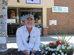 Simon Joynes, Port Stanley Festival Theatre’s artistic director, sits outside the theatre on the village’s main street. The theatre was the recipient of an Ontario Arts Council grant of $36,100, which was announced by MPP Jeff Yurek on Tuesday. (Laura Broadley/Times-Journal)