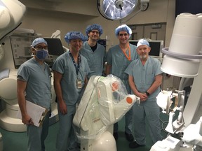 Dr. Jonathan Lau (left), Dr. Keith MacDougall, Dr. Holger Joswig, Dr. David Steven and Dr. Andrew Parrent, neurosurgeons at London Health Sciences Centre, during a training session on a newly acquired surgical robot. The new technology was recently purchased with the help of donations through the London Health Sciences Foundation and was used for the first time in Ontario on a robotic-assisted neurosurgical procedure in April 2017. (Photo submitted)