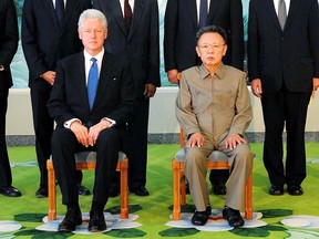 (FILES) This file photo taken on August 4, 2009 and released by North Korea's official Korean Central News Agency shows North Korean leader Kim Jong-Il (R) posing with former US president Bill Clinton (L) in Pyongyang. Former president Bill Clinton flew out of North Korea on August 5, 2009 with two US journalists sentenced to long jail terms after securing a pardon for them from leader Kim Jong-Il, Clinton's spokesman said.   KNS/AFP/Getty Images