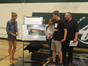 Students from W.C. Miller Collegiate unveil the mock-up of what the new gymnasium will look like at a press conference in Altona on Tuesday, July 25, 2017, to announce $4.5 million in funding for a new gymnasium for W.C. Miller Collegiate. CASSIDY DANKOCHIK/Red River Valley Echo/Postmedia Network