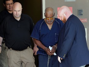 James Mathew Bradley Jr., 60, is escorted out of the federal courthouse following a hearing, Monday, July 24, 2017, in San Antonio.  (AP Photo/Eric Gay)