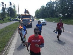 A runner makes his way towards on the highway as the Manitoba Hydro Torch Relay for the Canada Summer Games rolls into Winnipeg on Wednesday, just days before the opening ceremonies are set to kick off. The Winnipeg stretch of the relay will begin at Memorial Park at 9:30 a.m. with “Dancing” Gabe Langlois running the first stretch. HANDOUT