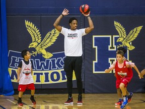 Toronto Raptors' DeMar DeRozan spends some time with young basketball players at the Raptors Basketball Academy held at Humber College in Toronto on July 25, 2017. (Ernest Doroszuk/Toronto Sun/Postmedia Network)