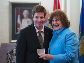 Brandon Bosma of Sherwood Park accepts his medal. The Queen Elizabeth II Golden Jubilee Citizenship Medal was awarded to eight young Albertans  by Lt.-Gov. Lois Mitchell at Government House in Edmonton. The award honours the citizenship and volunteer service of youth leaders.  Shaughn Butts / Postmedia