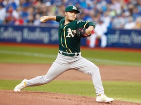 Oakland Athletics starting pitcher Sonny Gray delivers a pitch against the Toronto Blue Jays during first inning American League MLB baseball action in Toronto on July 25, 2017. (THE CANADIAN PRESS/Mark Blinch)
