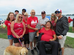 Submitted photo: Allan Anderson, centre, recently received his Sombra Optimist Citizen of the Year award from president Carla Aarssen (seated) as family and friends look on.