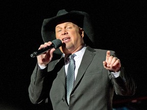 Country singer Garth Brooks performs at the National Christmas Tree Lighting attended by the first family on the Ellipse December 1, 2016 in Washington, DC.  (Photo by Ron Sachs-Pool/Getty Images)