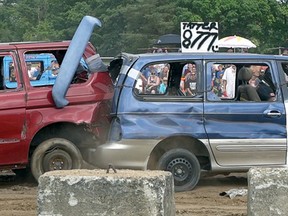 Parts go flying as two mini vans collide during Sunday's demolition derby at the Tillsonburg Fair. (Chris Abbott/Tillsonburg News)