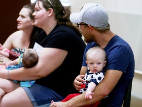 Kyle Chamberlain, right, sits with his daughter Sabrina at the Tillsonburg Fair baby show Saturday morning. (BRUCE CHESSELL/Postmedia Network)