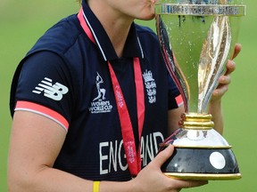 England captain Heather Knight celebrates with trophy after England won the ICC Women's World Cup 2017 final match against India at Lord's in London, England, on, July 23, 2017. (RUI VIEIRA/AP)
